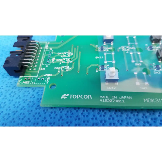 Green topcon control panel button switch circuit board with printed labels and black connector for retinal camera