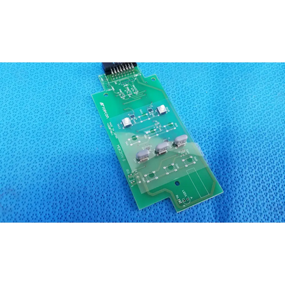 Green printed circuit board with silver components and black connector for mdK311V-0 control panel button switch