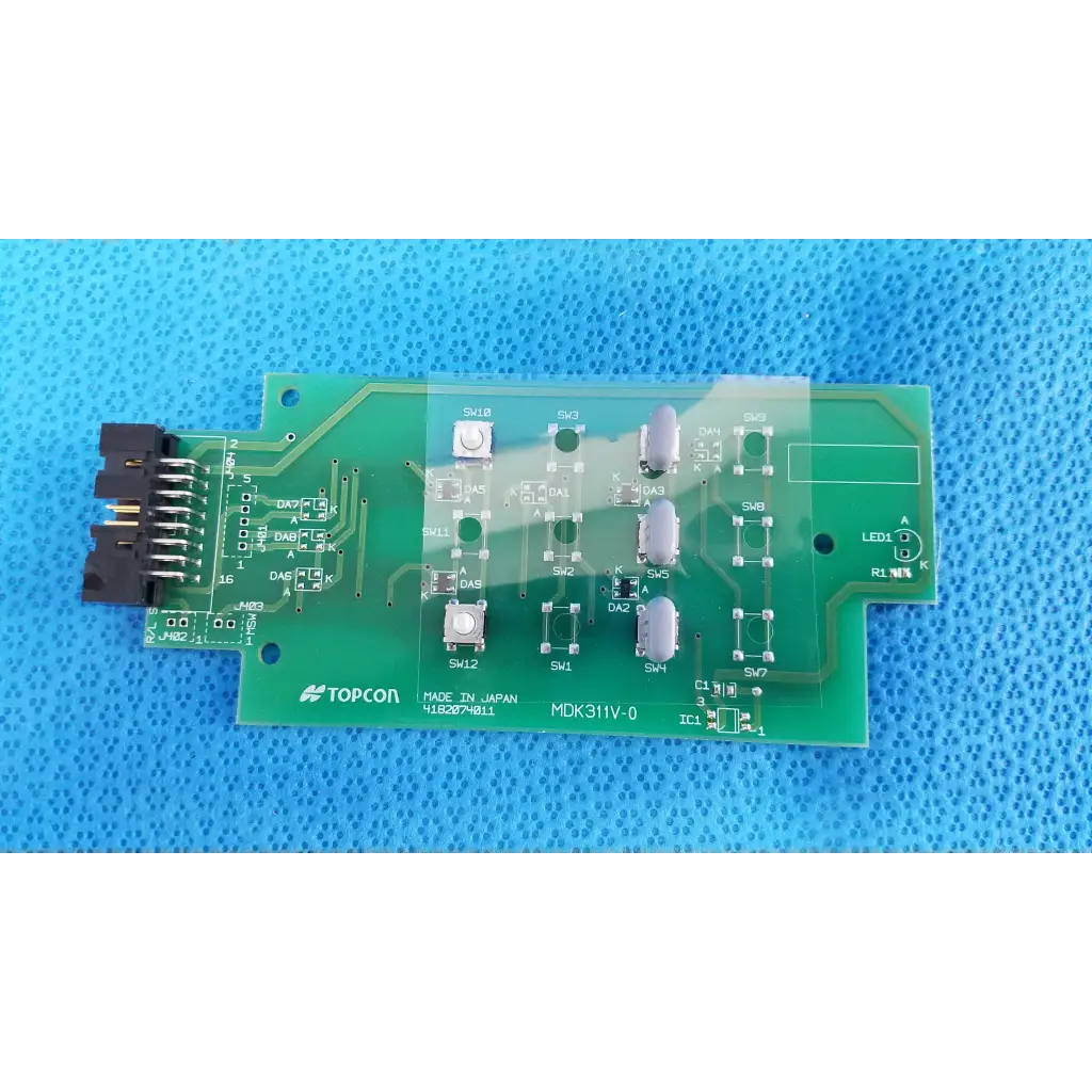 Green control panel button switch circuit board with silver components and black connectors for topcon retinal camera