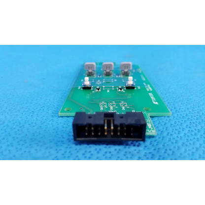 Green printed circuit board control panel button switch with three gray components and black connector for topcon camera