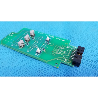Green control panel button switch circuit board with beige and black switches labeled topcon for retinal camera use