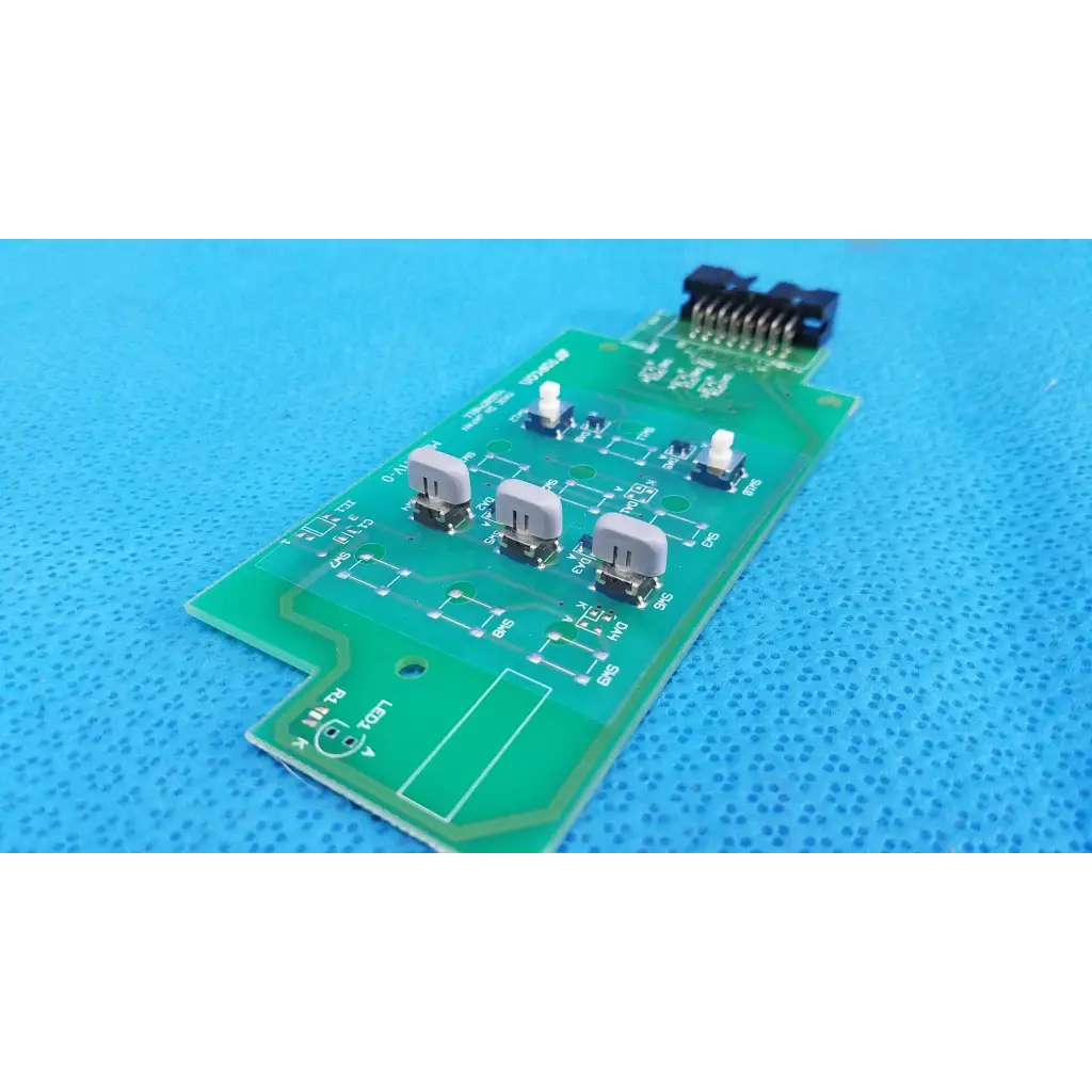 Green rectangular control panel button switch circuit board with three gray push-button switches and black connector