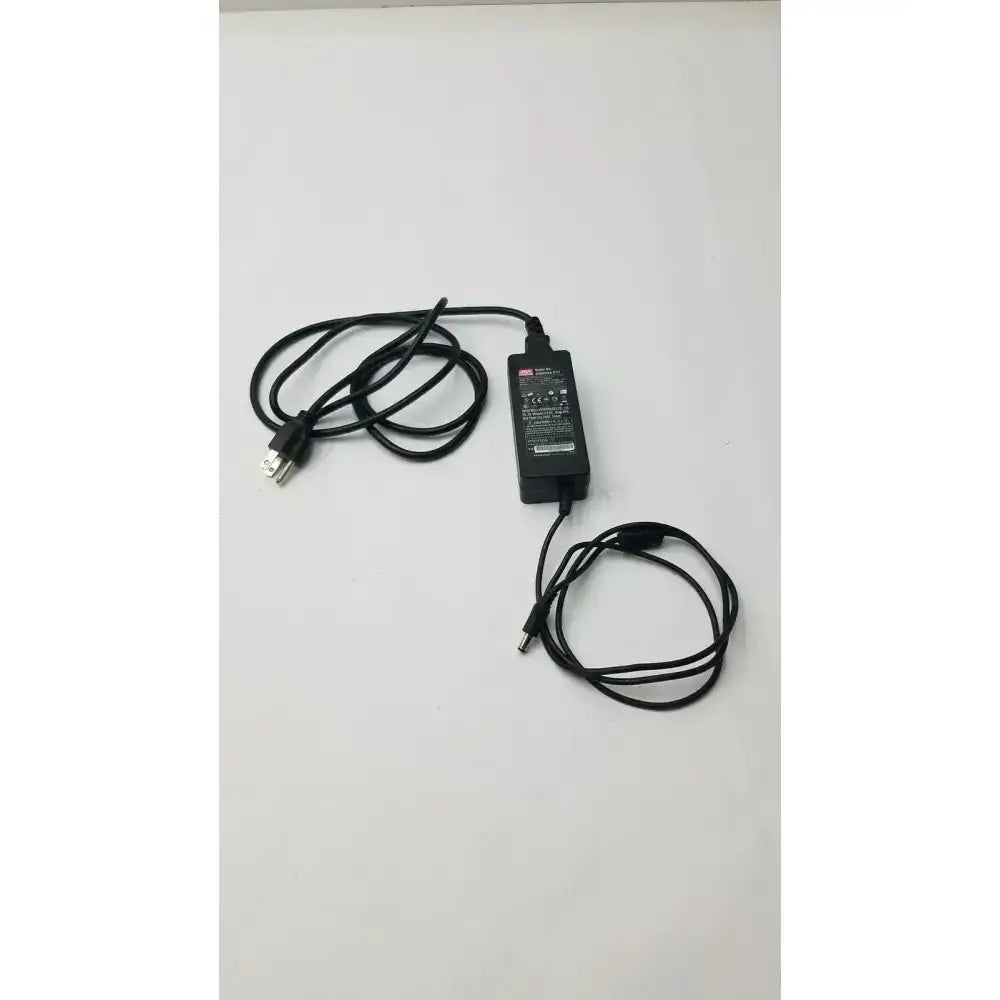 Black plastic mean well gs60a24-p1j power supply adapter with coiled cables and usb-c connector for versatile use