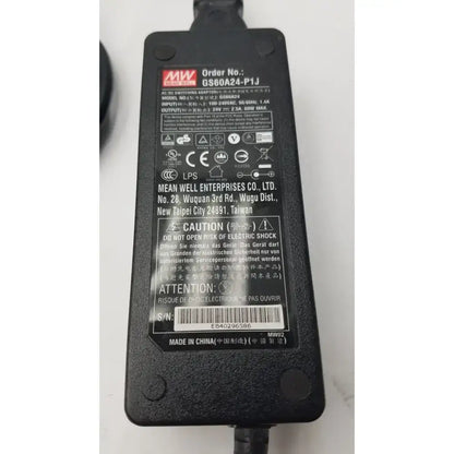 Black plastic mean well gs60a24-p1j power supply adapter with textured surface and printed specifications