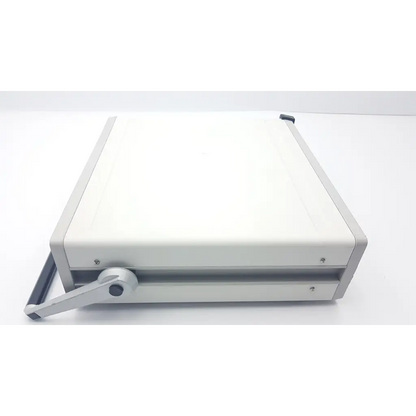 White rectangular paper cutter with silver handle and black accents for mecta spectrum 5000q ect convulsive therapy stimulator