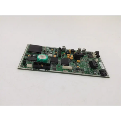 Green printed circuit board with black integrated circuits silver capacitors and green component in medfusion syringe pump main board pump main board pump