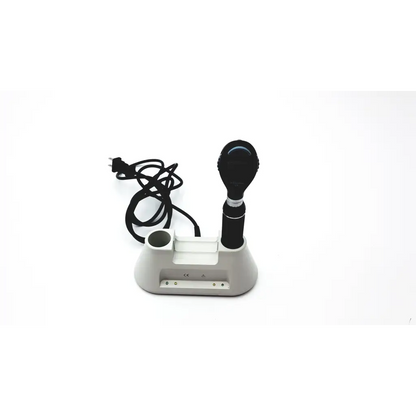 Black medline riester otoscope with silver metallic band resting in white plastic ophthalmoscope diagnostic desk set base