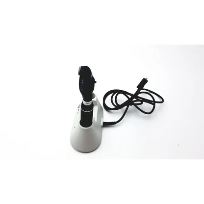 Black and silver medline riester otoscope with ergonomic design resting on its matching ophthalmoscope diagnostic desk set base