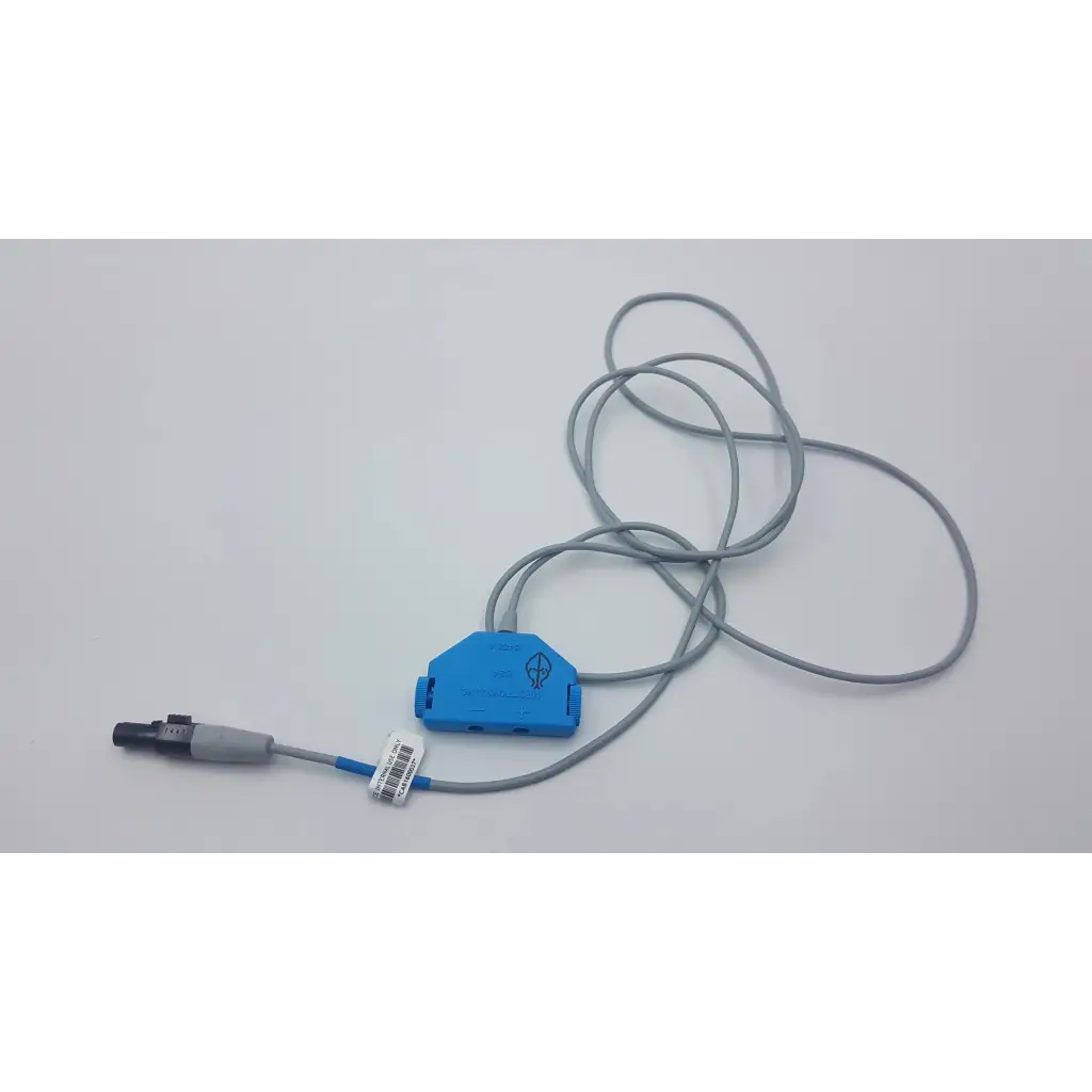 Blue plastic connector with gray cables and black-gray plug end on the back of medtronic 5391 single chamber external pacemaker