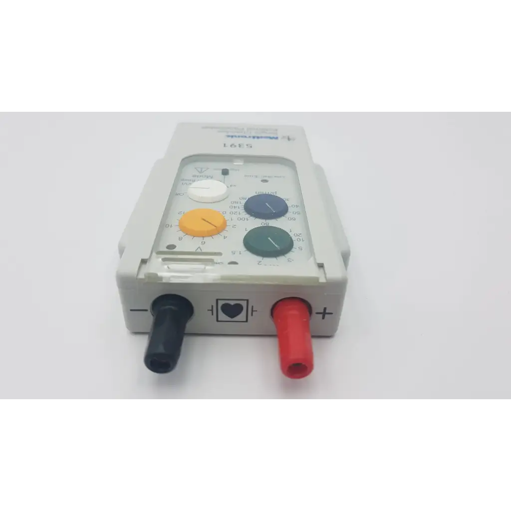 Gray plastic medtronic 5391 single chamber external pacemaker with colorful control knobs and red black electrode connectors