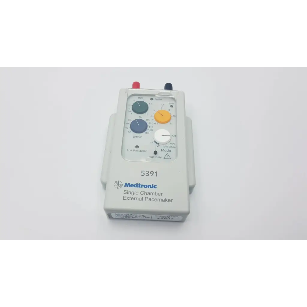 Medtronic 5391 single chamber external pacemaker with gray plastic housing and blue and yellow color-coded dials