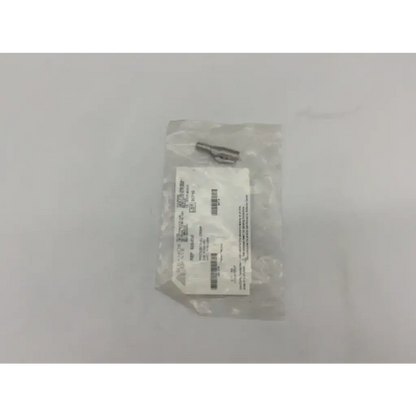 Metallic gray provisional clamp surgical stainless steel cylindrical connector in clear plastic packaging with white label
