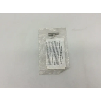 Silver metal screwdriver bit in clear plastic packaging with safety label for medtronic provisional clamp surgical stainless