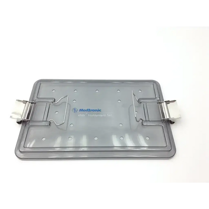 Gray translucent plastic medtronic env instrument tray with metallic clamps and medtronic logo for env instrument set