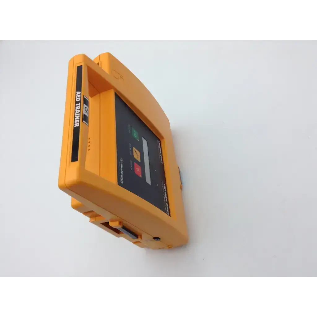Bright orange plastic med trainer device with black screen and colorful buttons for lifepak 500t aed training use