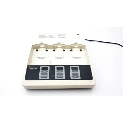 Beige medtronic physio-control battery support system 2 auto-infusion pump with black control panel and multiple buttons