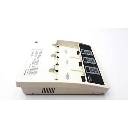 Beige plastic medtronic physio-control battery support system with black control panel and multiple test strip slots