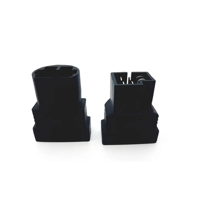 Black plastic mercedes benz-38 diagnostic connector with rectangular base and cylindrical top featuring metallic contacts