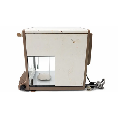 Vintage beige and white mettler h30 biomed certified analytical balance with glass enclosure and worn surface