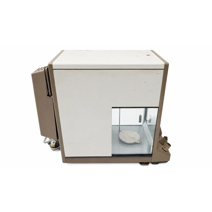 Beige and white mettler h30 analytical balance with transparent glass enclosure and circular weighing pan biomed certified