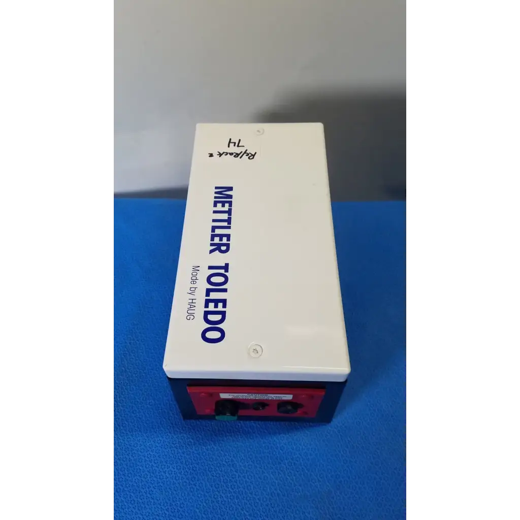 White and red mettler toledo haug en 8 slc power supply battery box with blue text labeling