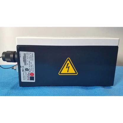 Black rectangular mettler toledo haug slc power supply with white top and yellow lightning bolt warning symbol from hannover