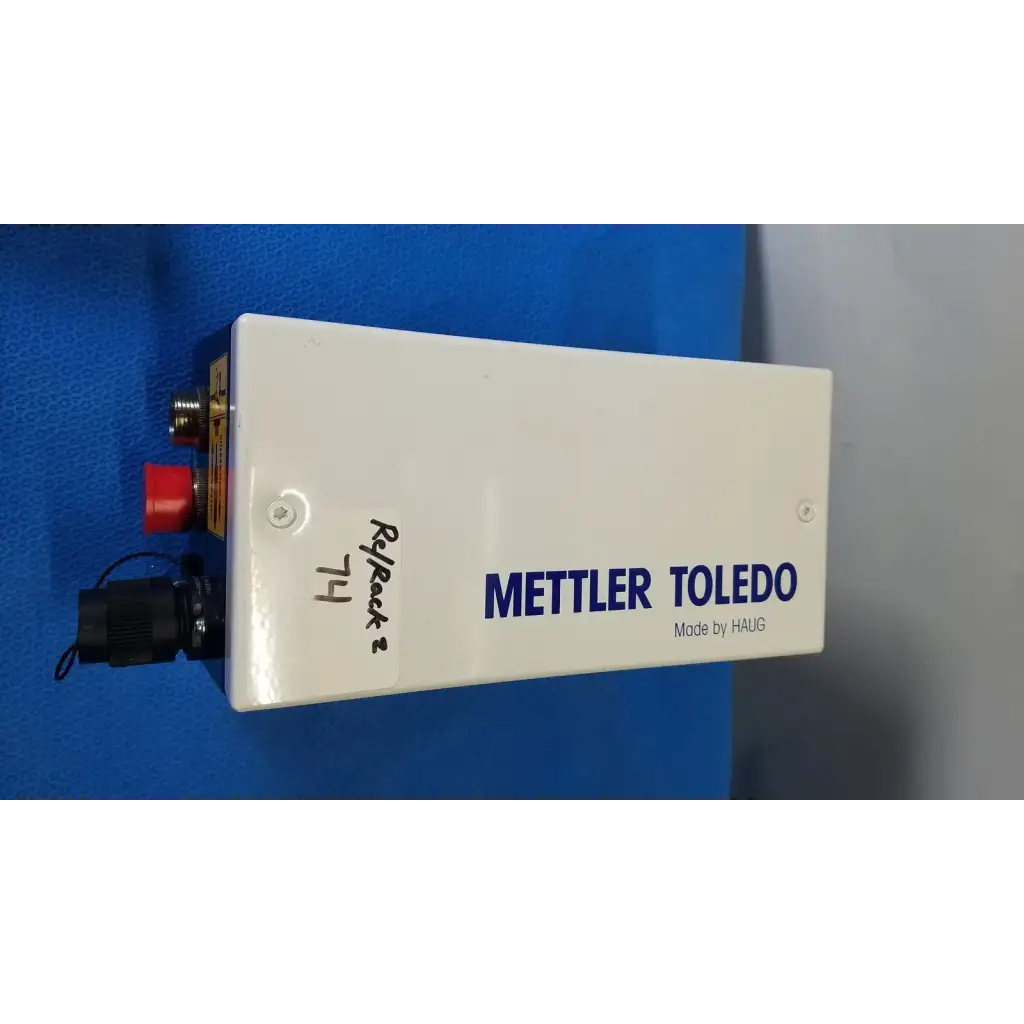 White rectangular mettler toledo haug industrial weighing scale with blue branding and red button for slc power supply use