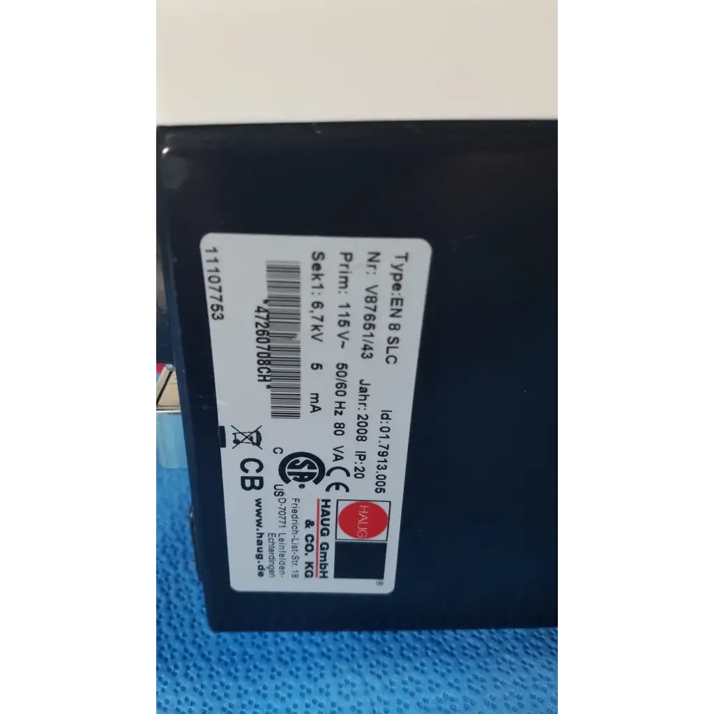 Black rectangular mettler toledo haug slc power supply with white label showing technical specifications on the back side