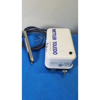 White rectangular mettler toledo haug static eliminator temperature controller with black coiled cable and metallic probe