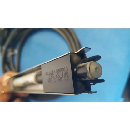 Silver rectangular metal housing with black plastic parts and coiled cable showing engraved serial numbers on mettler toledo haug static eliminator power supply back side