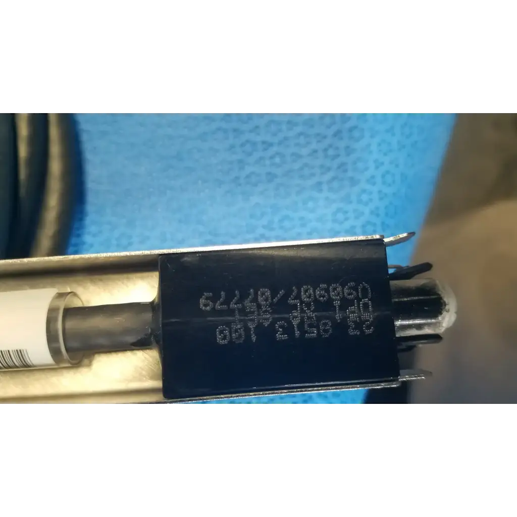 Black rectangular label with white alphanumeric code on mettler toledo haug static eliminator bar ionizing power supply 115v back