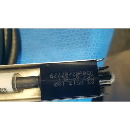 Black rectangular label with white alphanumeric code on mettler toledo haug static eliminator bar ionizing power supply 115v back