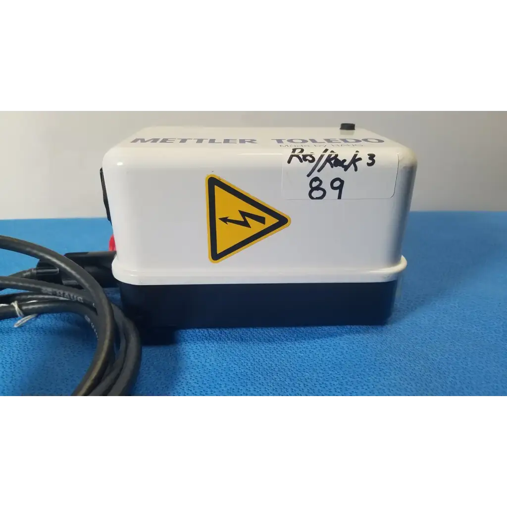 White and navy blue mettler toledo mettler toledo ro back 3 water purifier showing the haug static eliminator bar system ionizing power supply with yellow warning label