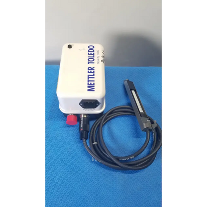 White mettler toledo haug static eliminator power supply with red button and black coiled cable for ionizing use