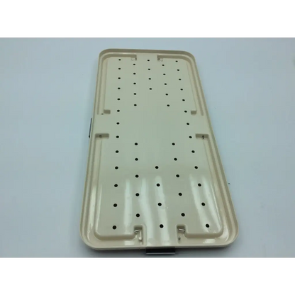 Beige plastic surgical instrument tray with circular holes and reinforced edges for micro-aire smartrelease ectr carpal tunnel release handpiece set