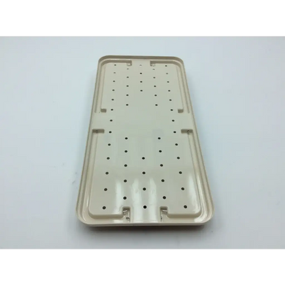 Beige plastic tray with perforations and raised edges for micro aire surgical instruments with 2x cases