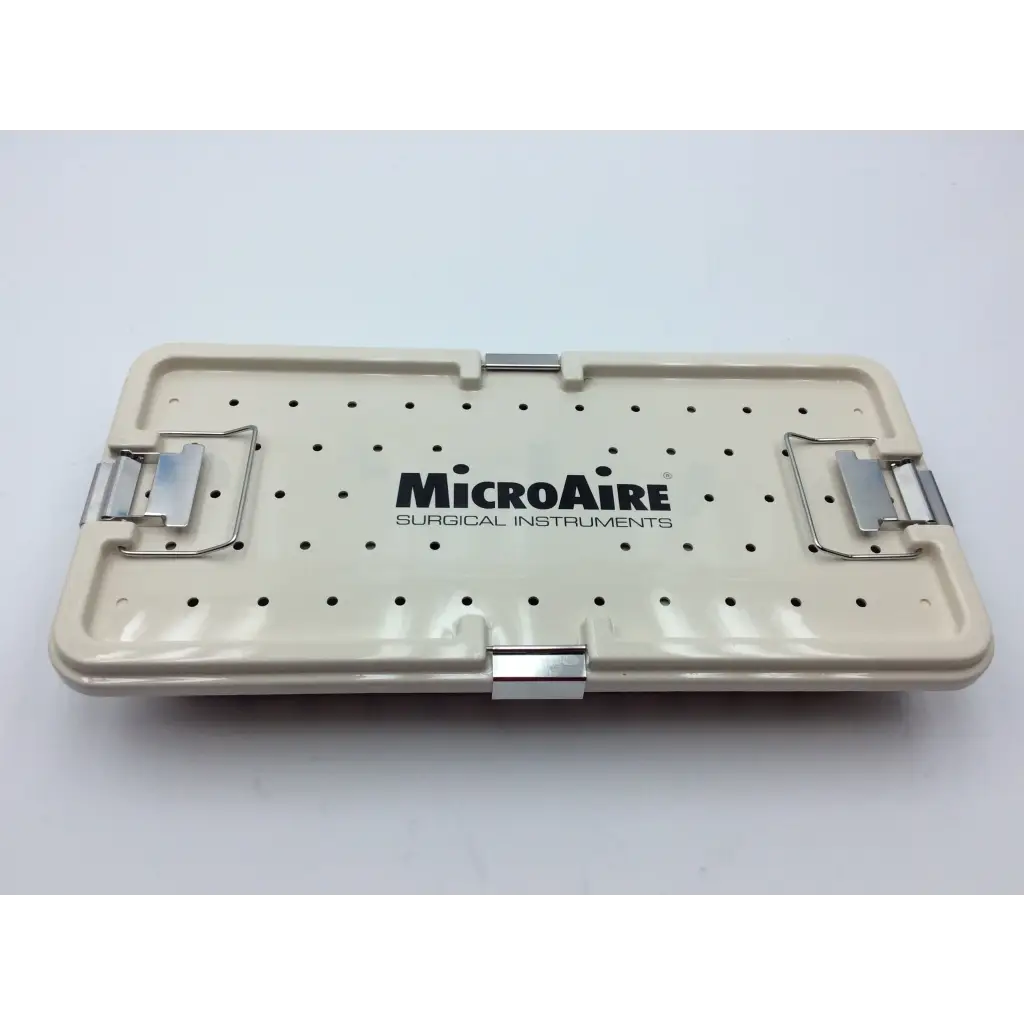 Cream-colored plastic micro aire surgical instrument tray with silver metal latches and perforated surface for sterile storage
