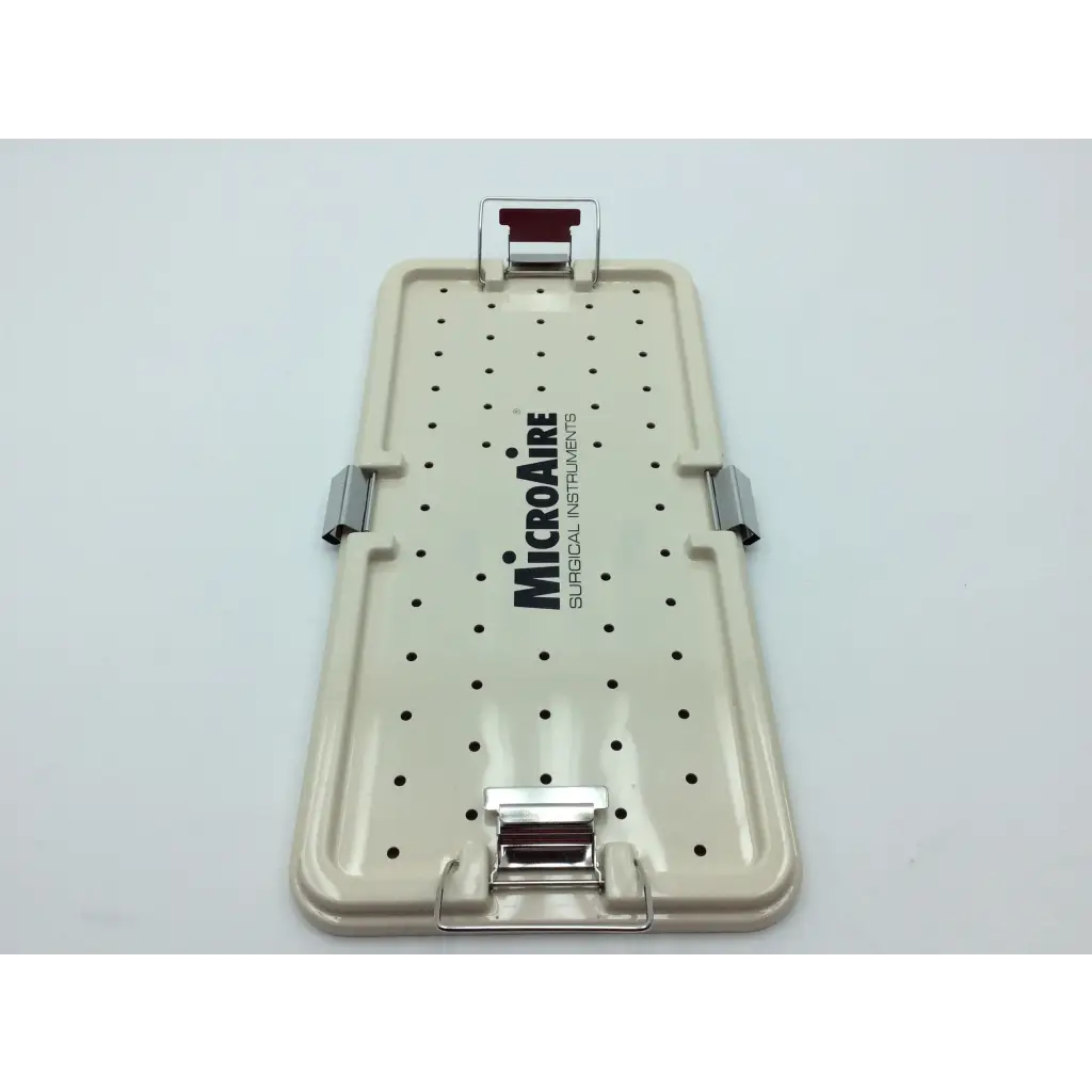 Beige plastic micro aire surgical instrument tray with black perforations and silver metal latches for secure storage