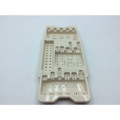 Beige plastic surgical tray with molded compartments and perforations for micro aire surgical instruments cases