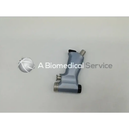 Gray ergonomic microaire 1641 smartdriver handpiece with metallic accents and black grip sections for precise control