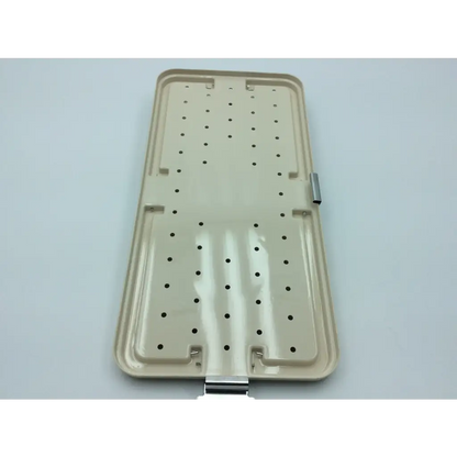Beige plastic surgical instrument tray with circular holes and metallic latches for smart release carpal tunnel drill set