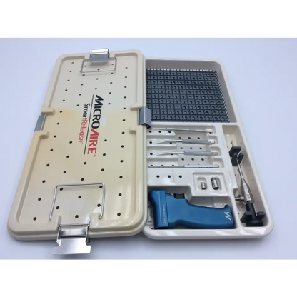 Beige plastic case with silver latches containing microaire 81014 smart release carpal tunnel drill set with blue surgical tool