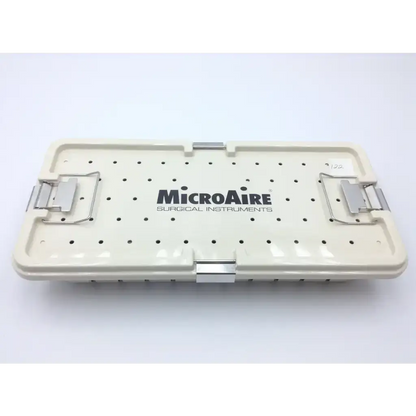 Cream-colored plastic microaire surgical sterilization tray with silver metal latches and perforated lid for microaire ref use