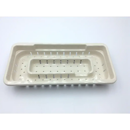 Beige plastic microaire surgical sterilization tray with perforated design and raised compartments for instrument storage