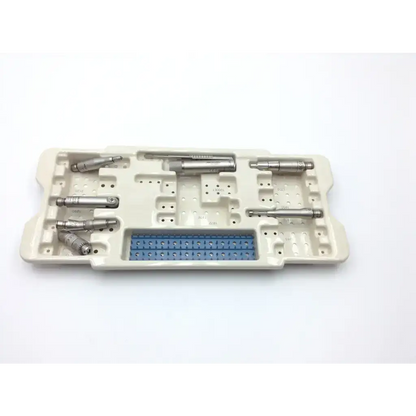Beige plastic sterilization tray with silver microaire surgical instruments and blue component for microaire ref use