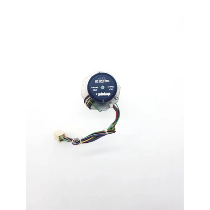 Compact gray motor with black circular faceplate and white markings connected to multicolored wires on spacelabs mpc860 nibp assembly board