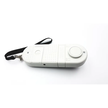 White plastic remote control with textured grip and black wrist strap for microrpm respiratory muscle testing device
