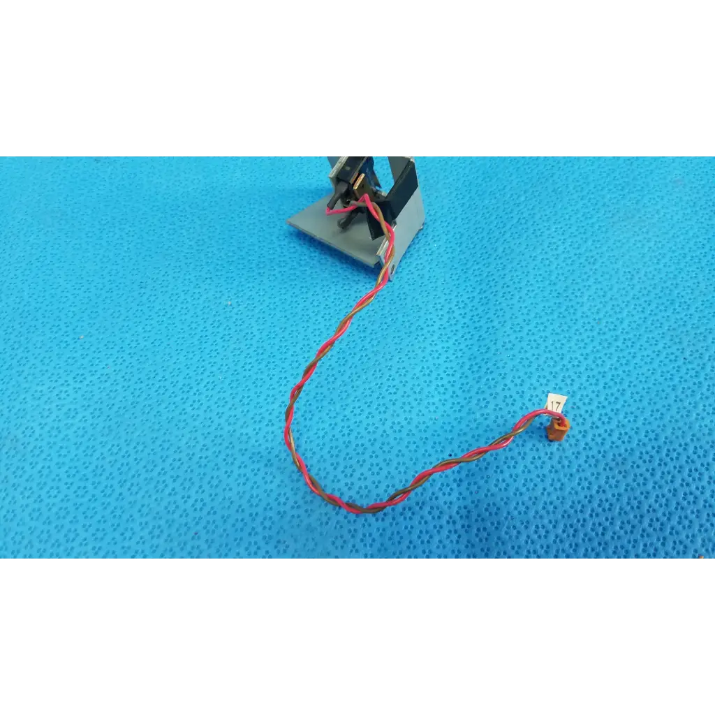 Red and black twisted wire cable with orange connector for microswitch limit sensor bracket assembly on retinal camera