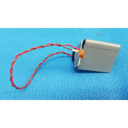 Silver rectangular microswitch limit sensor with twisted red and brown wire and orange connector for retinal camera bracket assembly