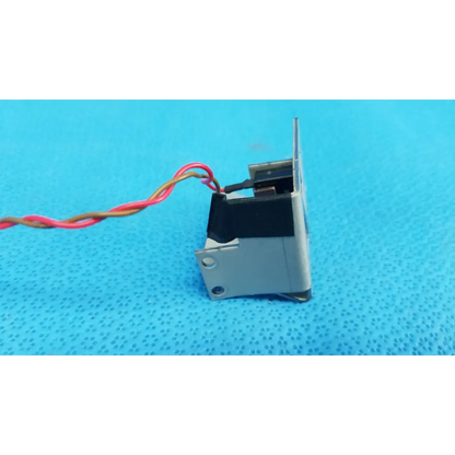 Silver metallic microswitch limit sensor bracket assembly with black section and red yellow wires for retinal camera